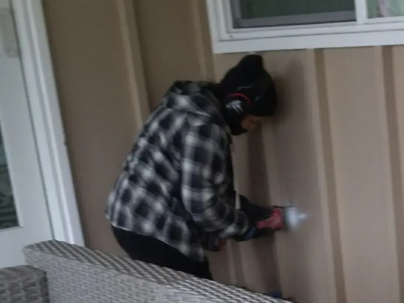 Professional electrician installing an exterior outlet in Burbank